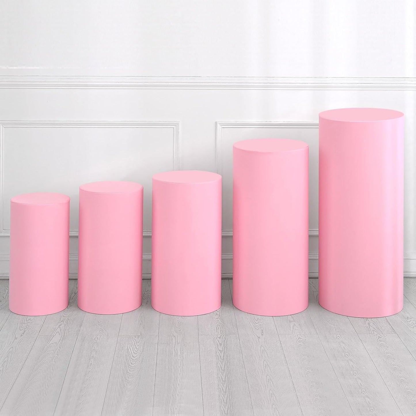 Set of 5 pink metal cylinders