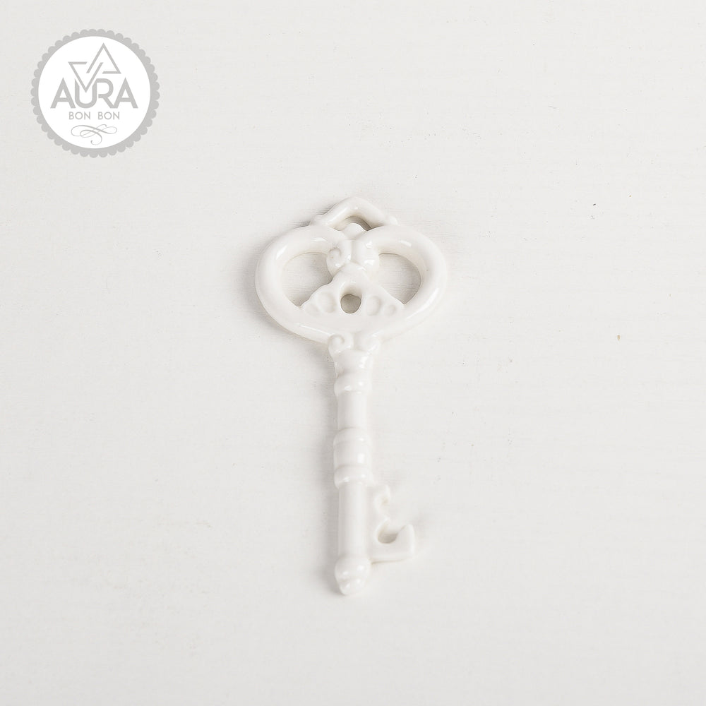 White ceramic key 9.2x4.2x0.5cm